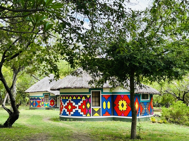       Traditional Ndebele huts with colorful designs.
  
