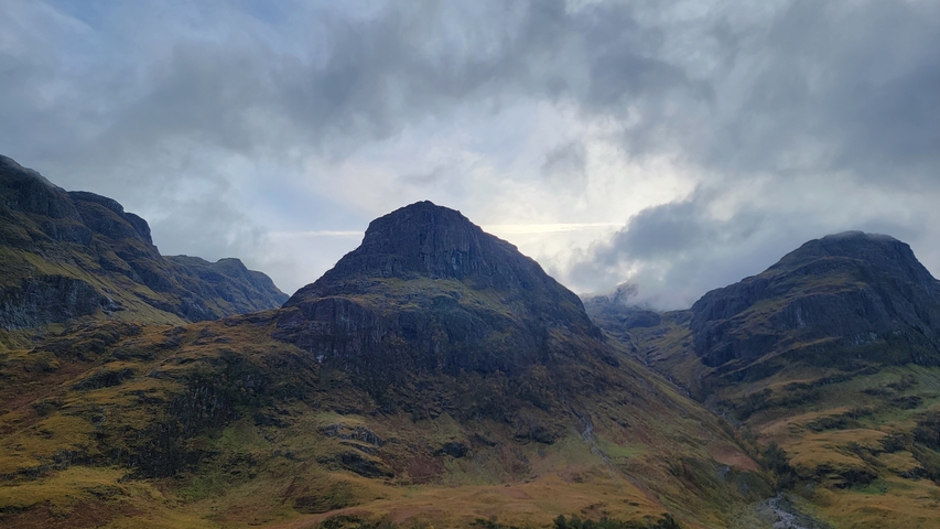       Mountains with a moody sky in the background.
  