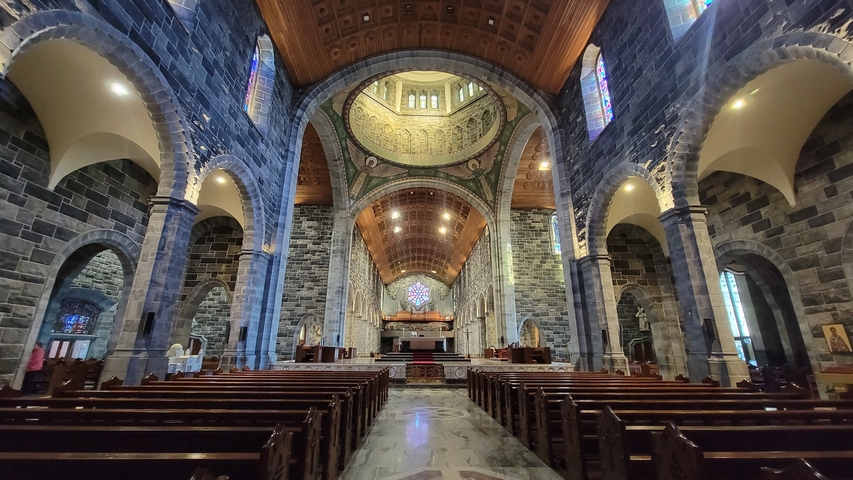       Interior of a grand cathedral with detailed architecture.
  