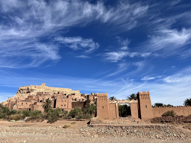       Historical fortress with traditional architecture against a blue sky.
  