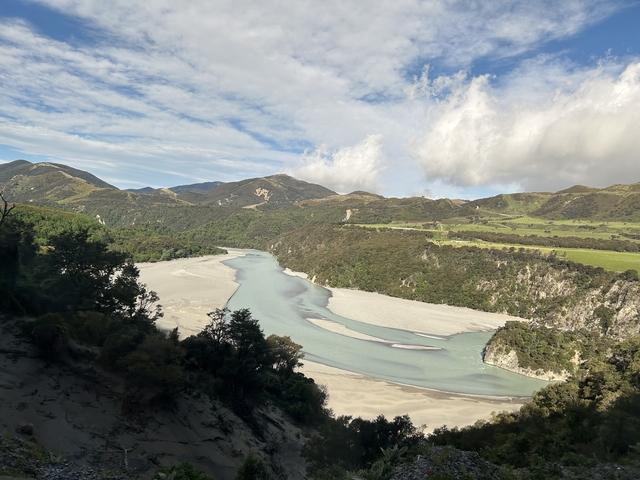 Scenic view of a winding river through mountains and valleys.