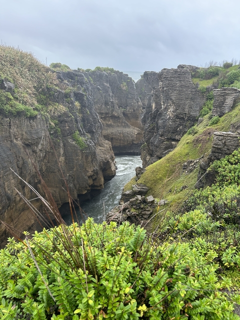 Rugged coastal landscape with cliffs and ocean.