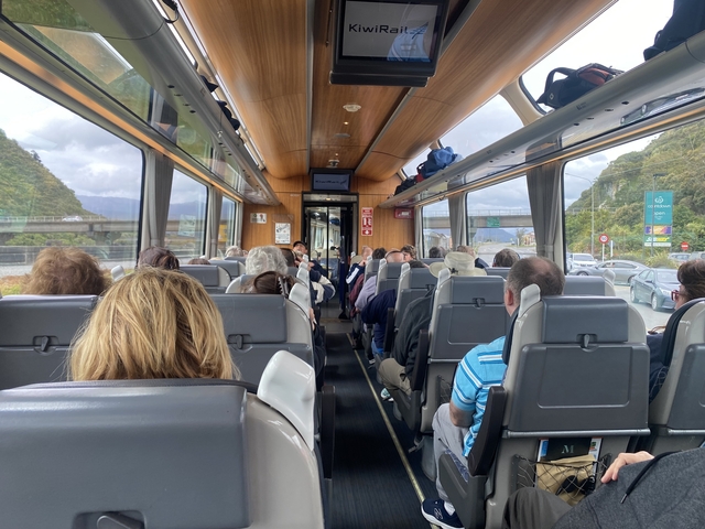 Interior of a bus filled with passengers.