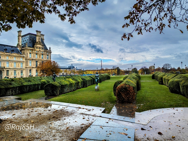Gardens of the Louvre with the Eiffel Tower in the distance.