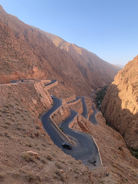       Winding road through a rocky gorge.
  