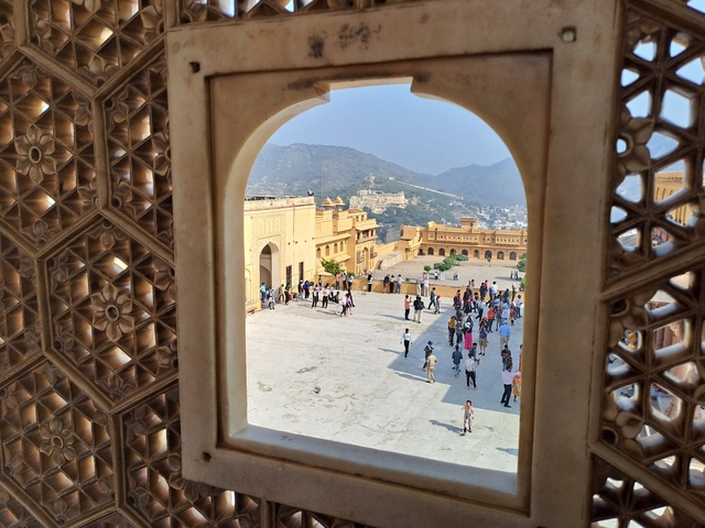 View from a historic fort with visitors walking around.