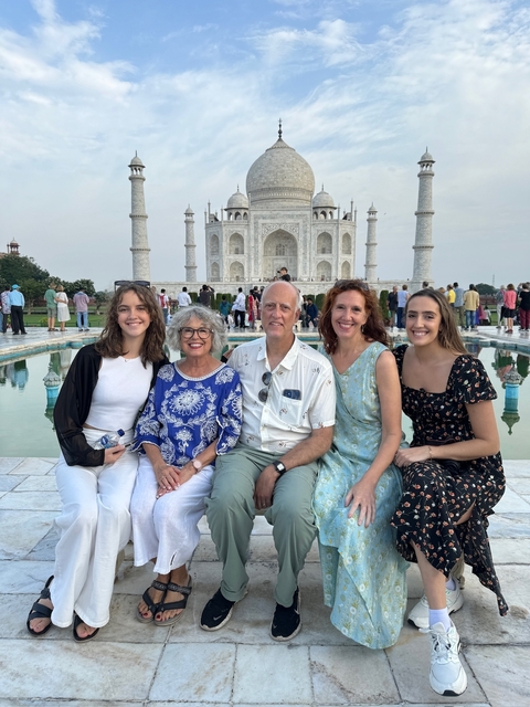       A group photo in front of the Taj Mahal.
  