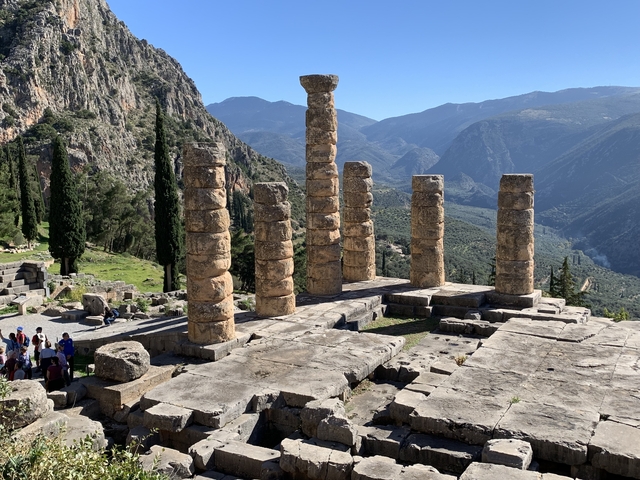       Ancient ruins overlooking a mountainous landscape.
  