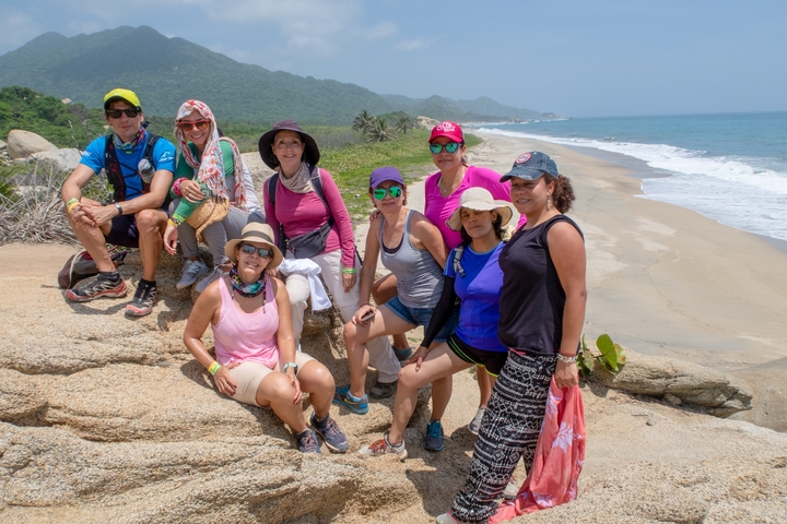 Group posing at a beach.