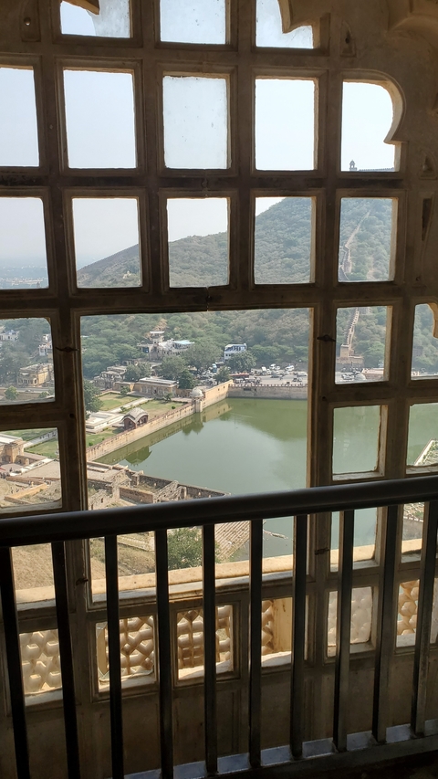       Aerial view of a fort with a body of water in front.
  