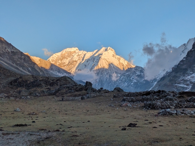       Snow-capped mountain range under a clear sky.
  