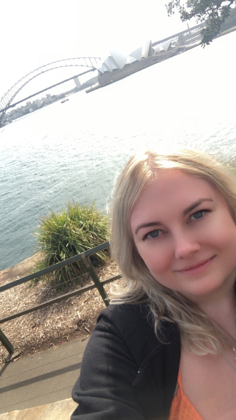       Selfie of a person with a body of water in the background.
  