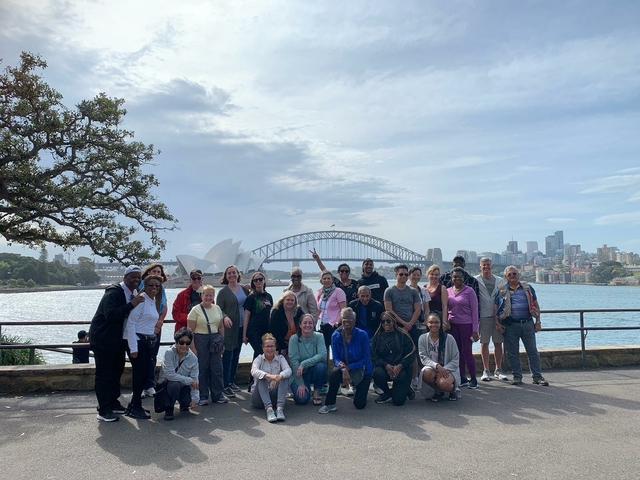 Group photo with the Sydney Opera House and Harbour Bridge in the background.