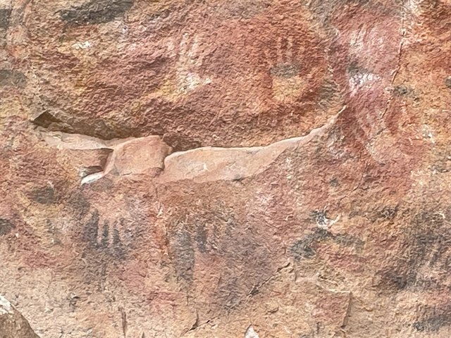 Close-up of ancient rock art on a wall.