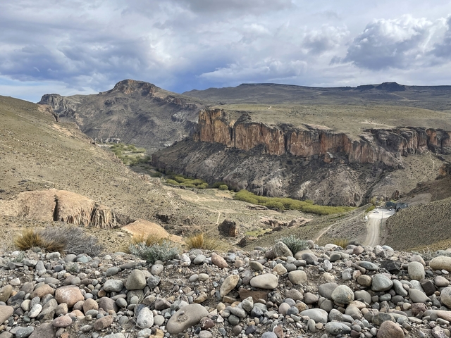 A canyon landscape with rocky outcrops.