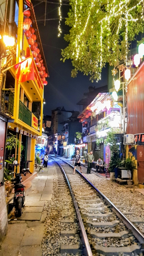 Night market street with people and vibrant lights