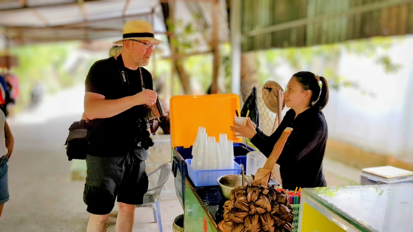       Man purchasing snack from a street vendor
  