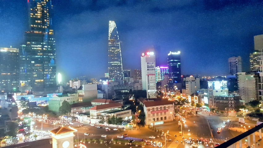 City skyline at night with illuminated buildings