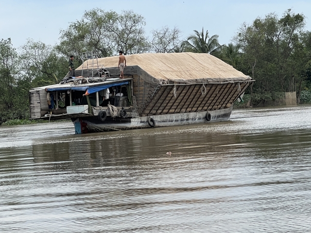 Wooden cargo boat on a river