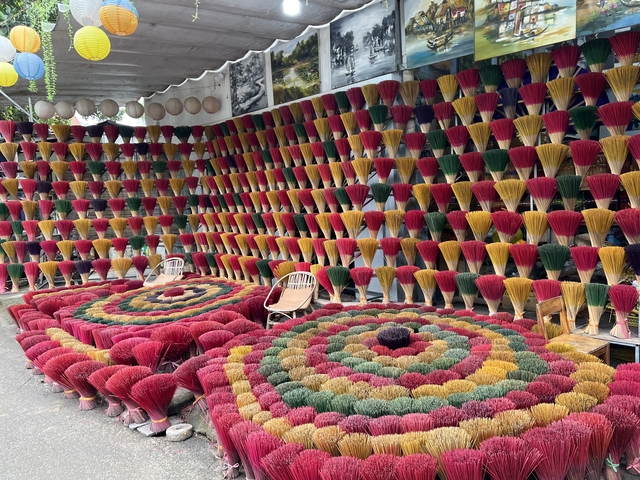       Display of colorful incense sticks arranged aesthetically
  