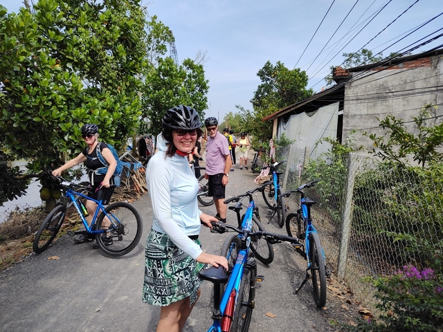       Cyclists preparing to ride on a rural road
  
