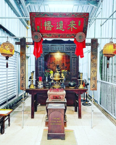       Intricately designed altar with incense in a temple.
  
