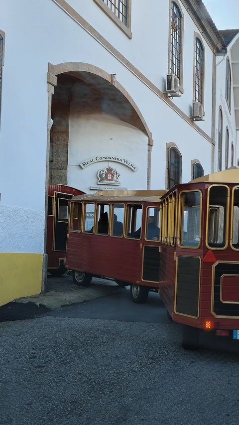       Old building with a traditional sign and cable car.
  