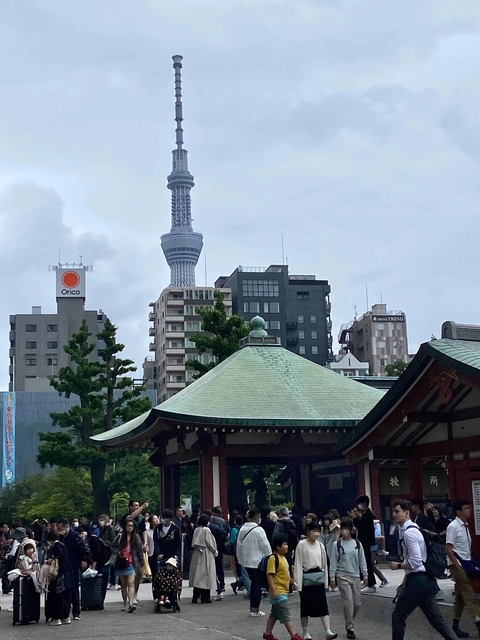 Modern city buildings with a view of the Tokyo Skytree.
