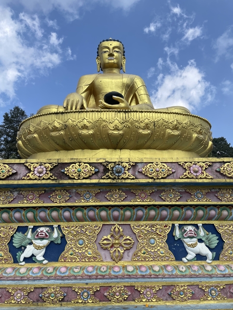       Golden statue with intricate designs.
  