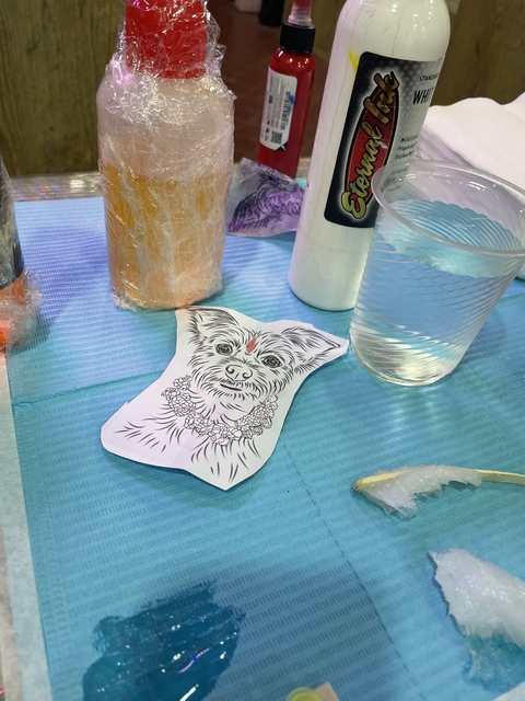       Illustration of a dog with other items on a table.
  