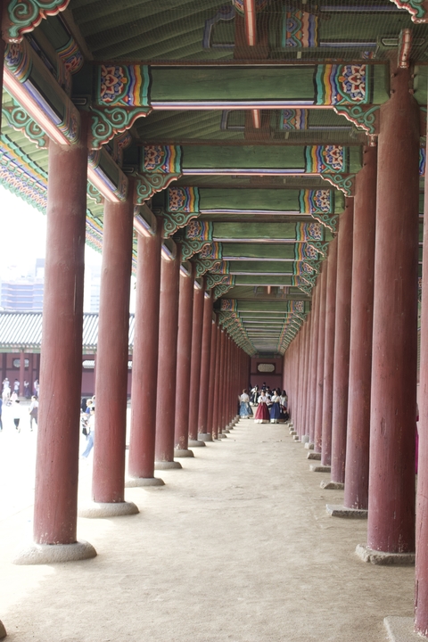 Interior of a historical building with decorative pillars.