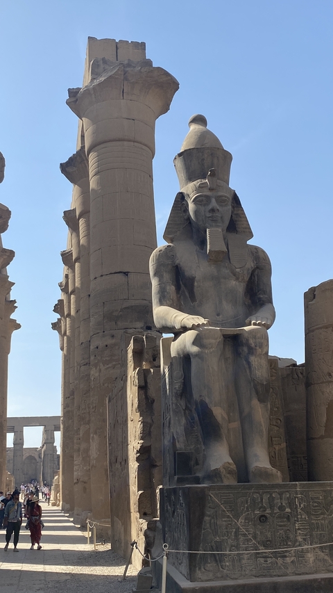 Ancient Egyptian statue and columns.