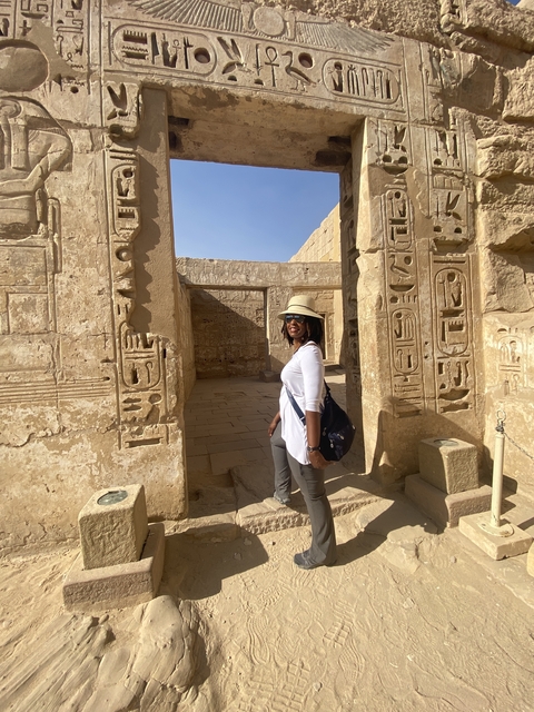 Tourist exploring ancient Egyptian ruins.