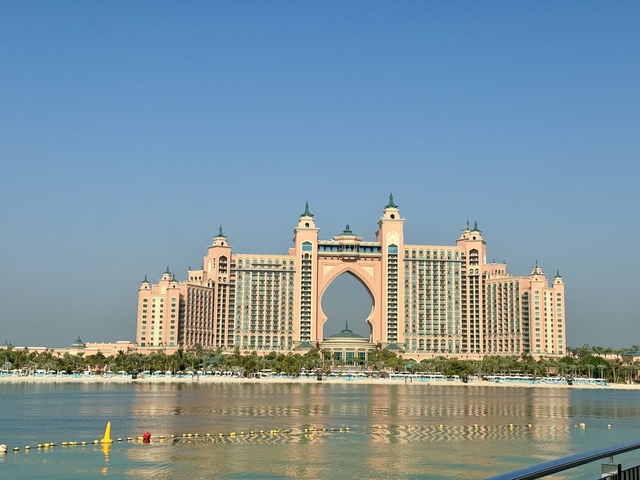      Palatial building with water reflection.
  