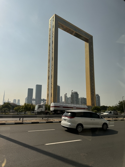       Dubai Frame with distant skyscrapers.
  