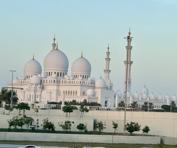       Grand mosque with minarets and domes.
  