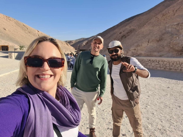 Tourists taking a selfie in a historical area.