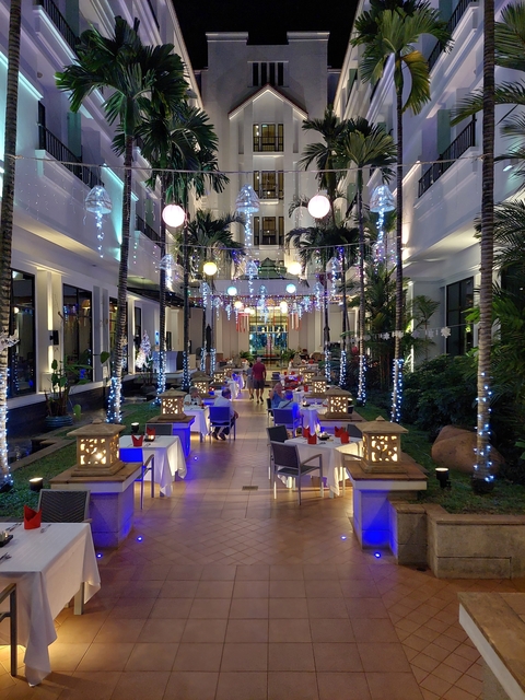 Elegant dining setup with lighting and decorations.