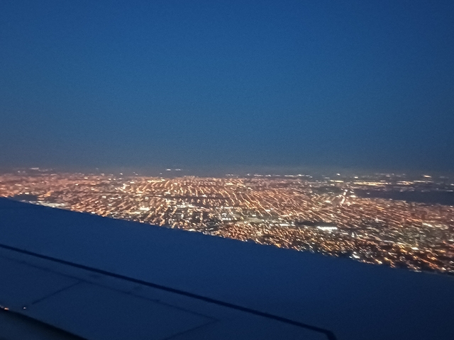 Blurry aerial night view of a city.