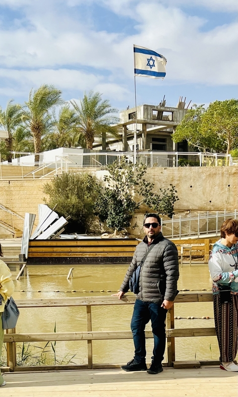       A person outside a modern city area with construction elements.
  