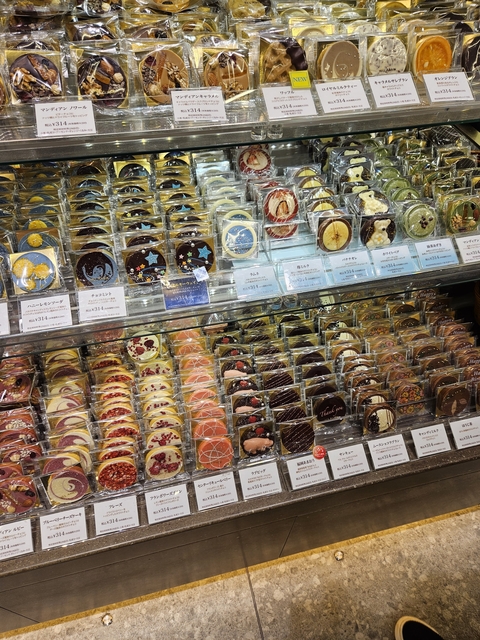       Stands filled with colorful decorative items for sale.
  