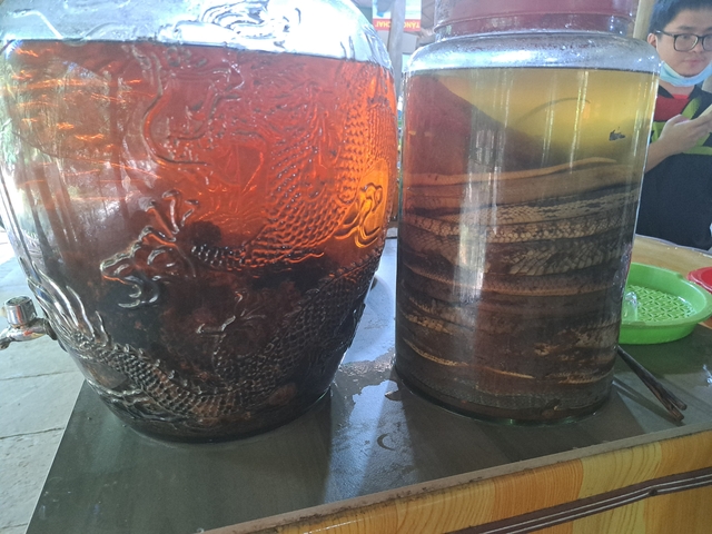       Glass containers filled with liquid and unidentified contents.
  