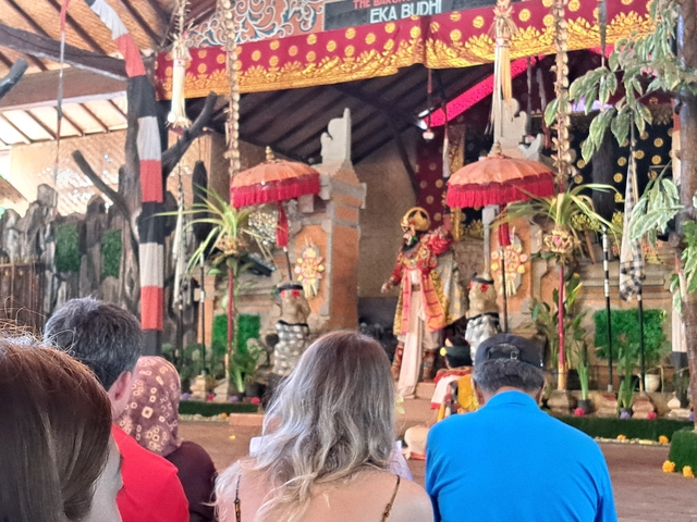       Cultural performance inside a temple setting.
  