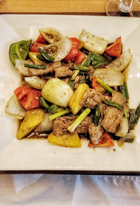       Stir-fried dish with vegetables and meat in sauce.
  