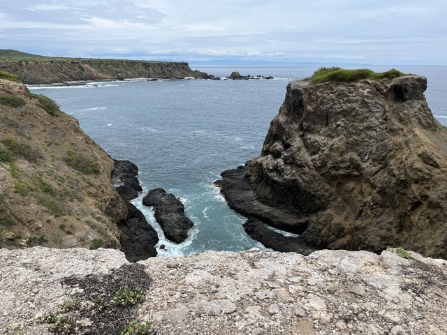       Rocky cliffs overlooking the ocean.
  