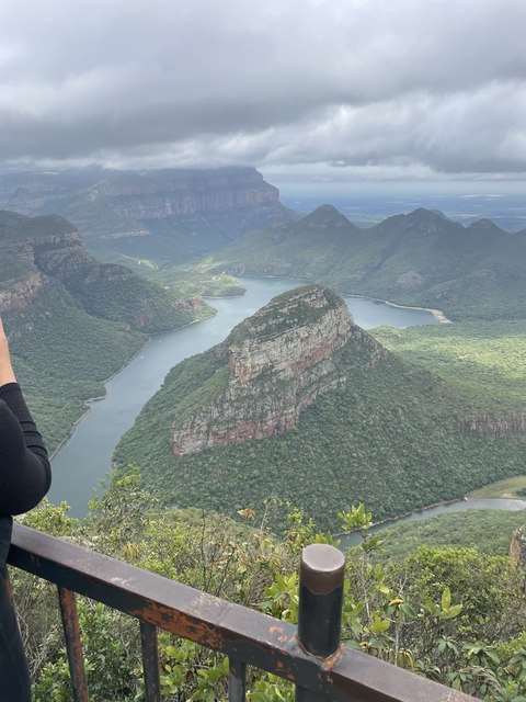 Scenic view of large rock formation and river.