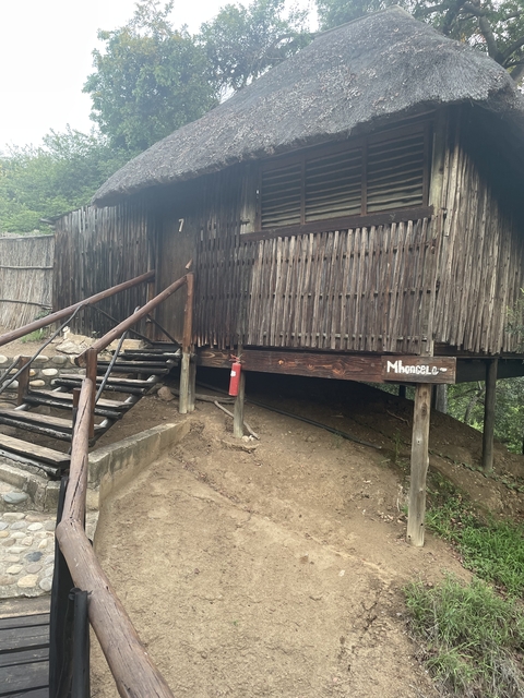 Traditional wooden hut on a raised platform.