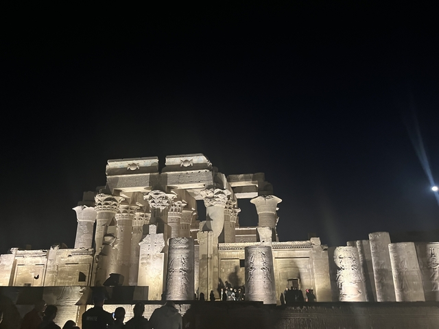       Well-lit temple structure at night, possibly part of an ancient ruin.
  