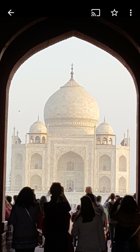 Framed view of the Taj Mahal focusing on its dome.