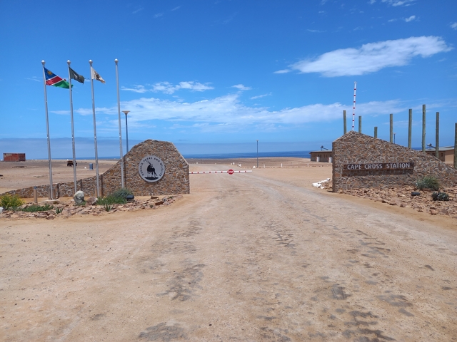 Entrance to Cape Cross Station with flags flying.